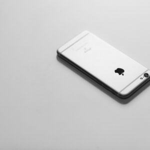 Elegant minimalist image of a smartphone on a white background.