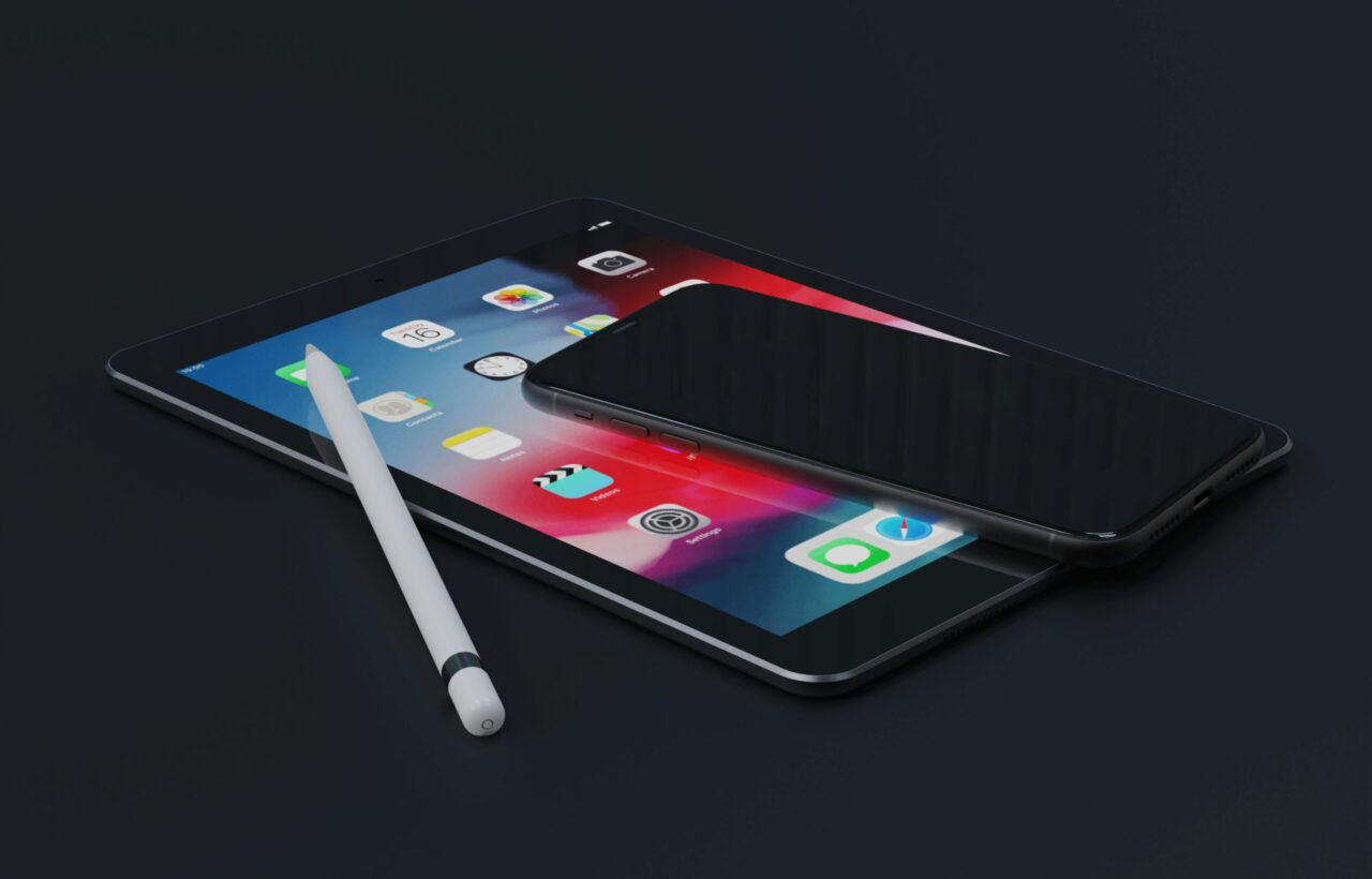 pexels photo 8622843 8622843 High-angle view of an iPad, iPhone, and stylus on a dark surface, showcasing modern technology.